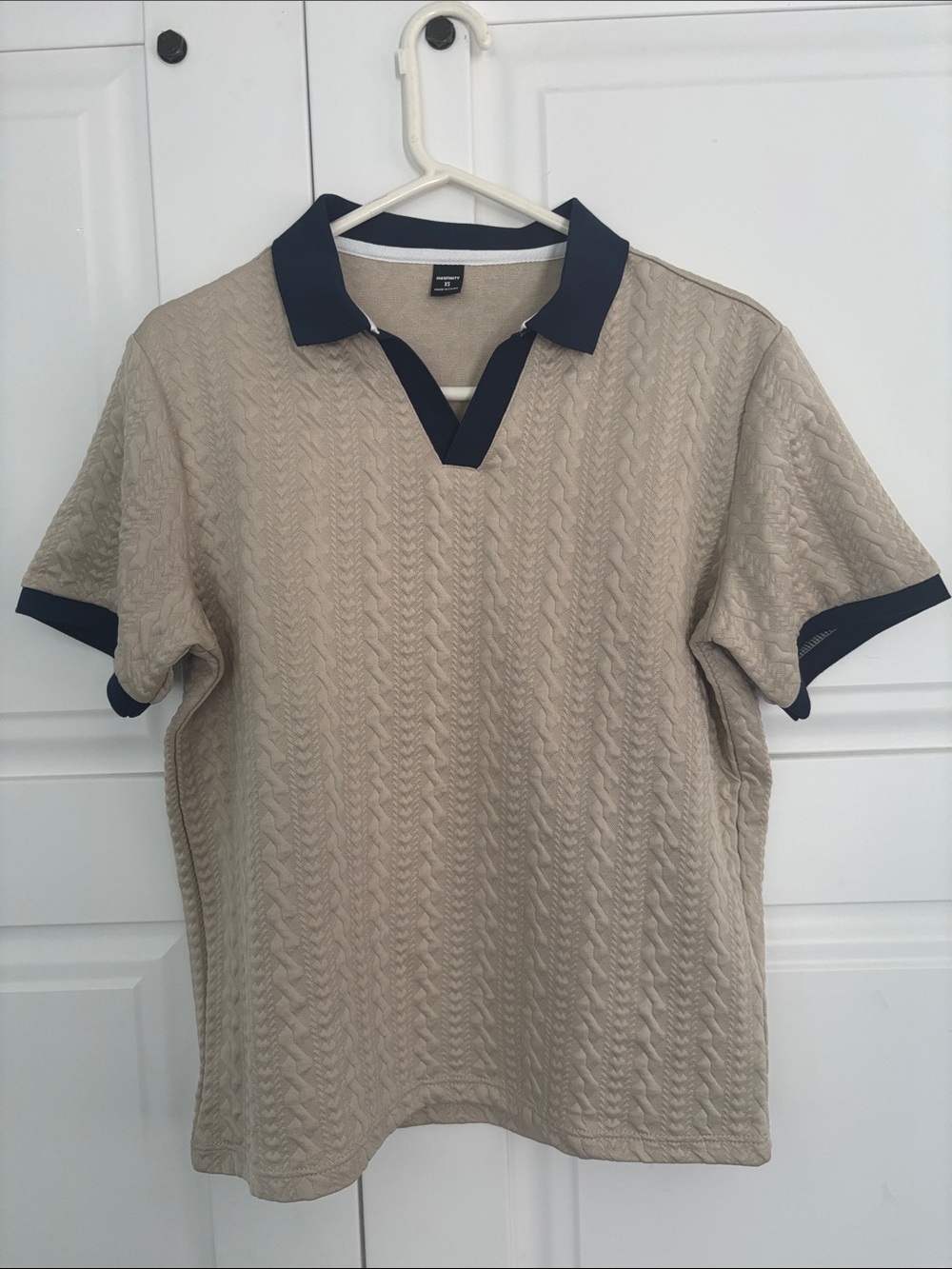 Brand new, never worn (no tags) 
Men's Beige Polo Shirt with Navy Trim